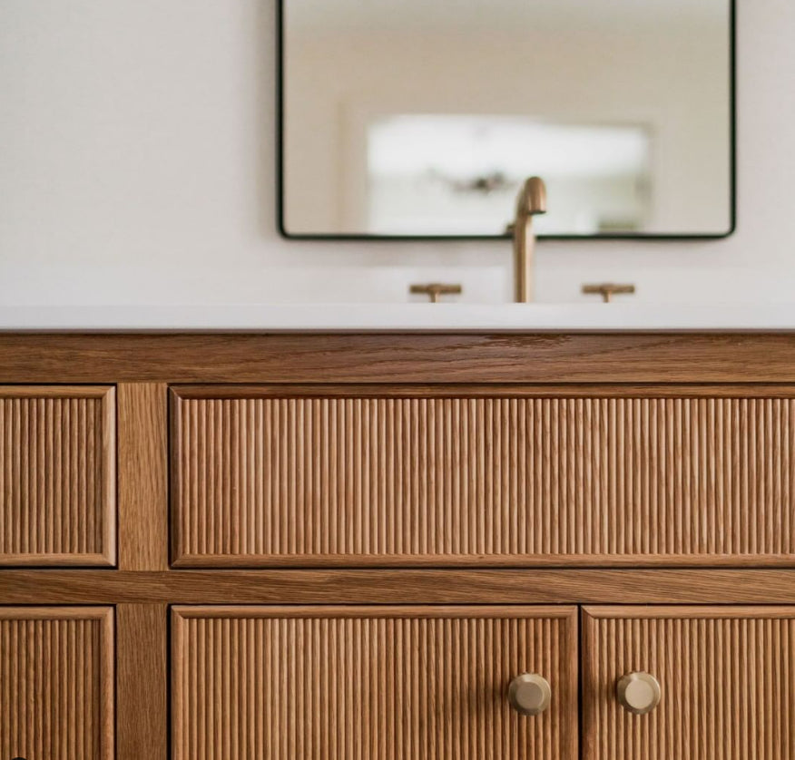 From Trees reeded wood vanity with a stone top and brass faucet